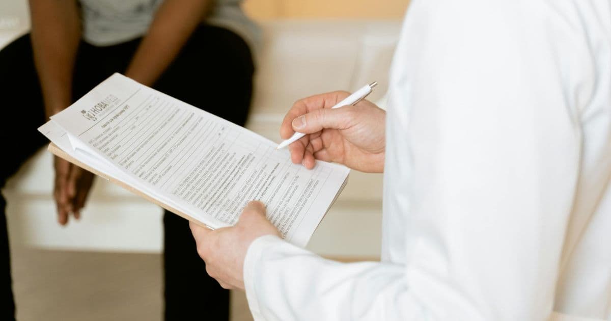 Medical billing CMS-1500 form and paperwork on a desk