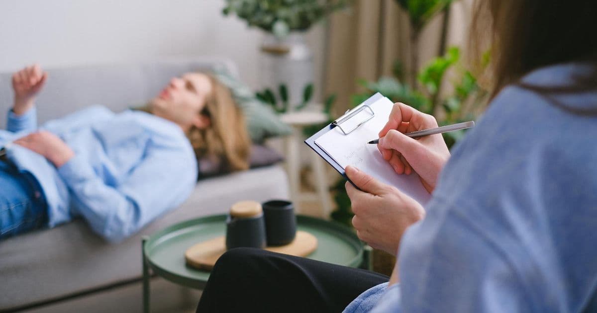 Psychologist sitting with a patient during a therapy session