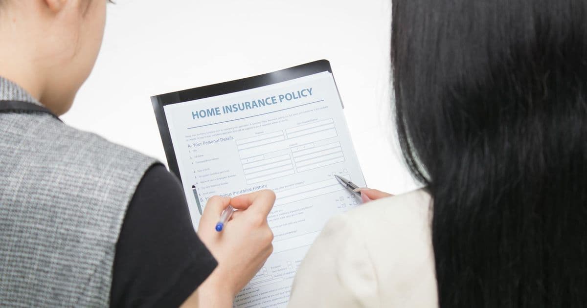 Person reviewing an insurance claim form for appeal