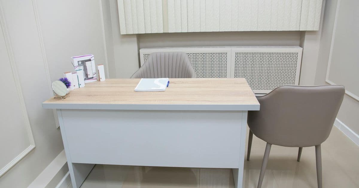 Therapist setting up a private practice office space