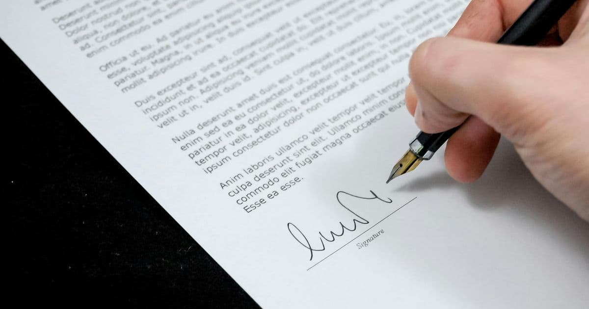 Person carefully reading a healthcare document at a desk