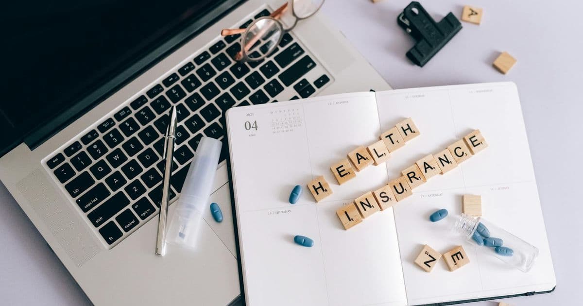 Woman using a laptop to research healthcare insurance options