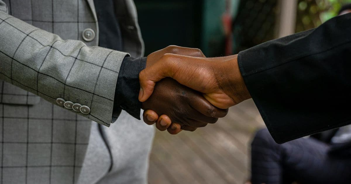 Business professionals shaking hands on an agreement