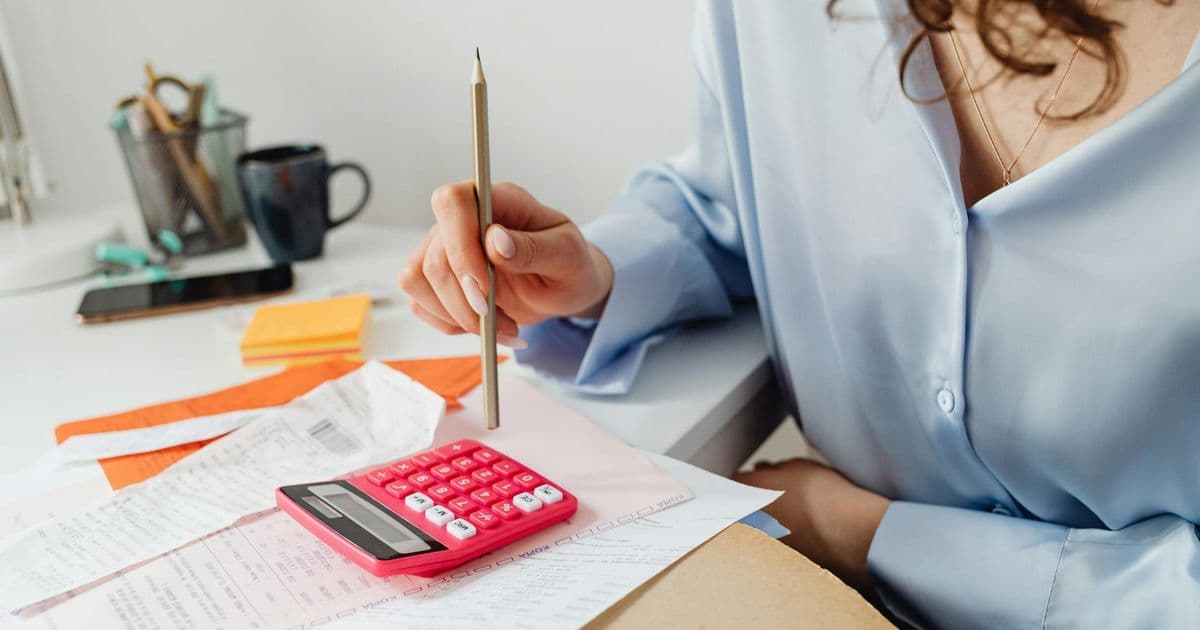 Therapist organizing billing paperwork and superbill documents