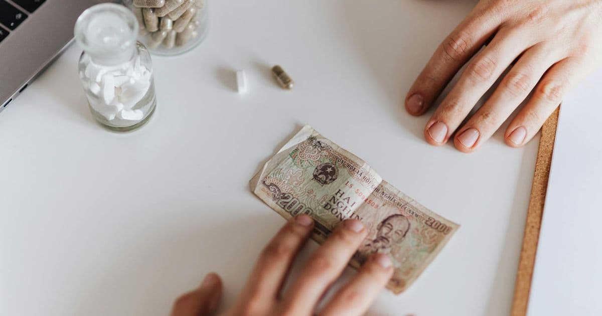 Person considering therapy costs without insurance coverage