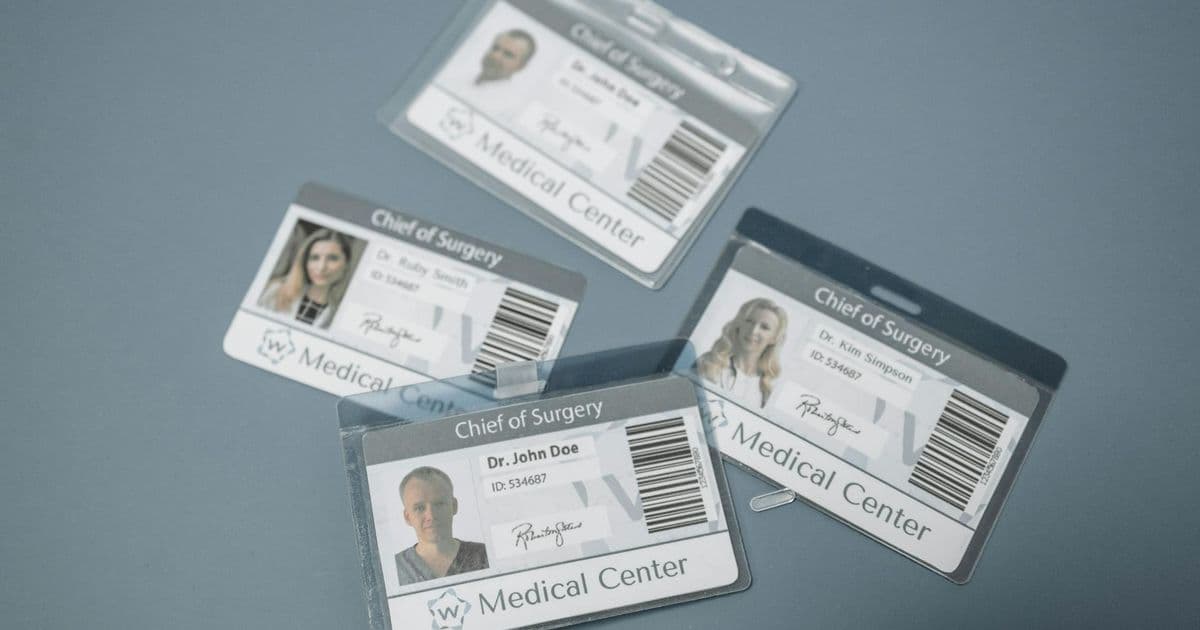 Healthcare professional displaying their identification credentials
