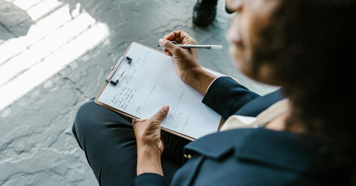 Counselor writing clinical session notes