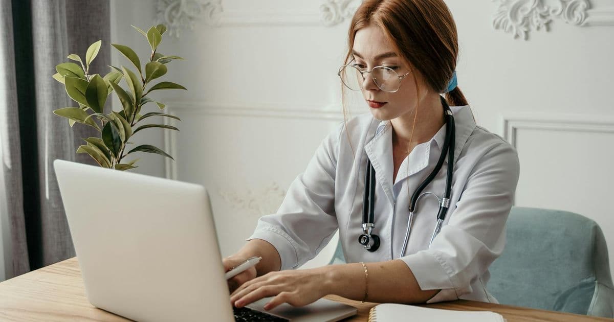 Healthcare billing professional at a desk