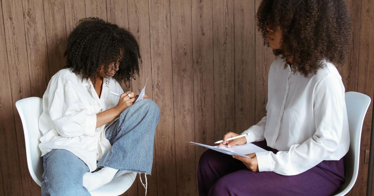 Therapist writing documentation and clinical notes